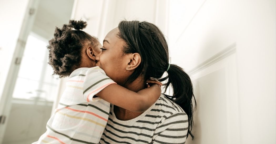 mom hugging her daughter